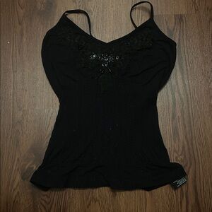 Black, stretchy Y2K shirt made in the 2000s